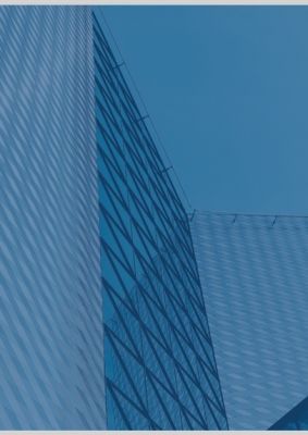 蓝灰色高级城市建筑商业策划PPT背景图片